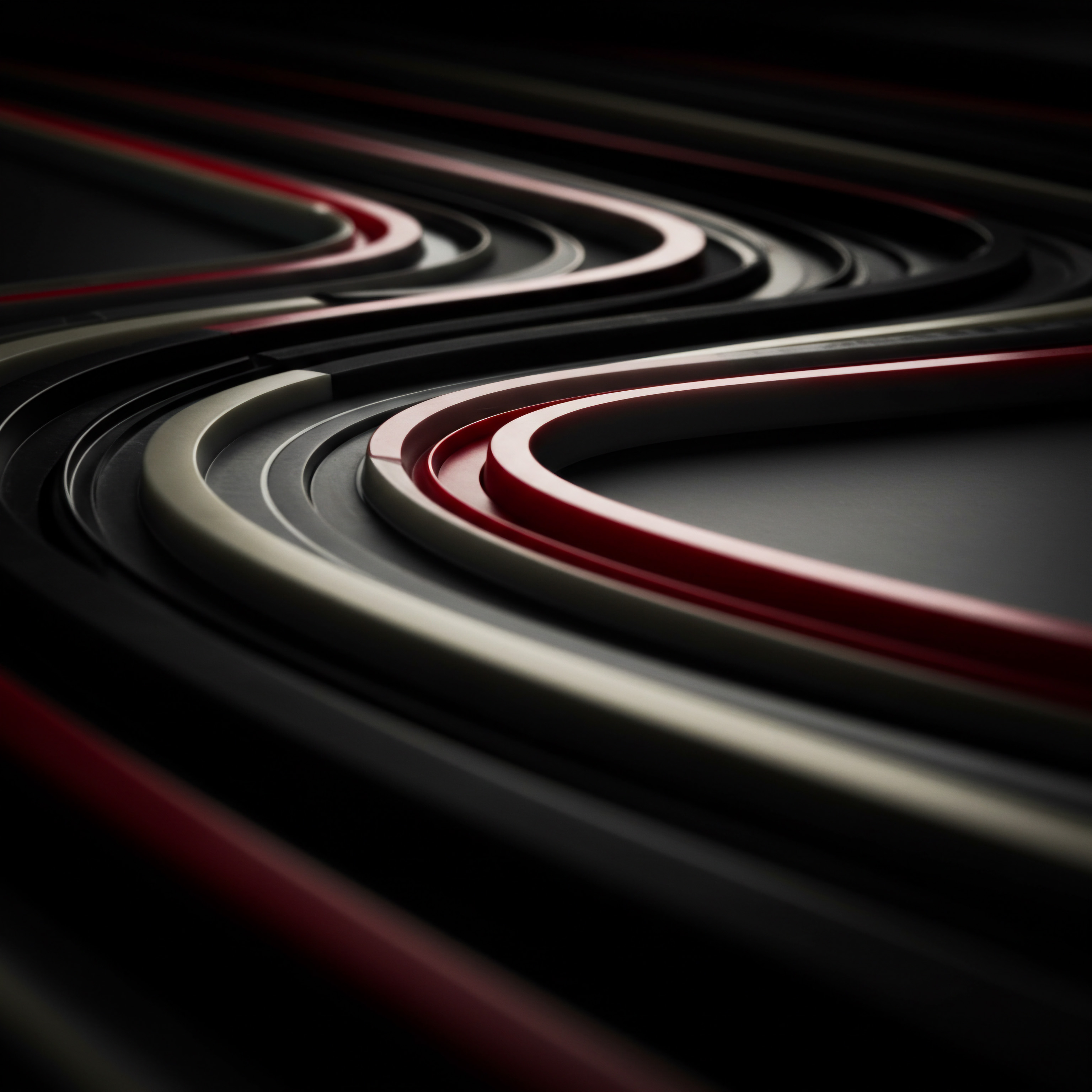 Multiple curving lanes of black, white, and red tones dominate the scene, creating a three dimensional abstract visual suggestive of business solution avenues and opportunities. This composition implies pathways that could represent Small Business and Medium Business strategic planning or growth initiatives. Each path illustrates routes that a startup or established company might follow in its scaling business phase. The interwoven structures might visualize the interdependence within an Enterprise or across Industry sectors. Modern workplace efficiency can be optimized through digital transformation, improved workflow, and better Time Management and project planning. A company looking to achieve Success through strategic Marketing, innovative solutions and Data Analytics would benefit from streamlined processes that create scalable systems. Digital tools, cloud solutions, automation, and strategic alliances are pathways that guide any firm towards financial success and expanded market share. Business owners can leverage their connections and collaborative culture to empower leadership teams and inspire a shared vision across all operational aspects.