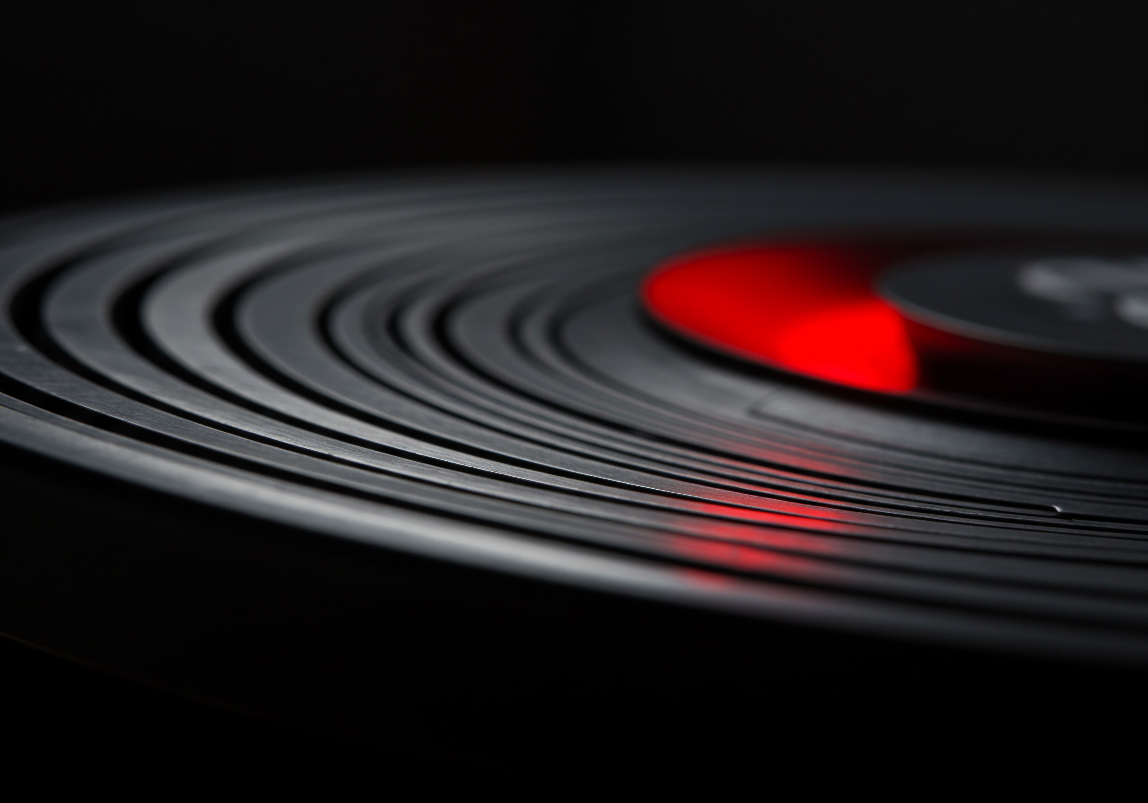 A dramatic close-up focuses on the grooves of a record reflecting a warm glow, embodying concepts applicable to Small Business. This record mirrors how businesses might leverage existing strengths to uncover hidden potential, symbolizing Opportunity for expansion in Market share. The play of light highlights innovative Technology used to Streamlined business Processes. Each circular Groove might relate to Scaling strategies or enhanced operational Efficiency. Imagine small Entrepreneurs harnessing these grooves representing their Workflow Automation to magnify medium sized enterprises. This visual underscores Data and reporting transforming into achievement. Business Owners, with Strategy and innovative Solutions building Business with vision towards Success and Future Growth in an optimistic Business Culture, supported by Digital Marketing and SaaS to offer the best Service.