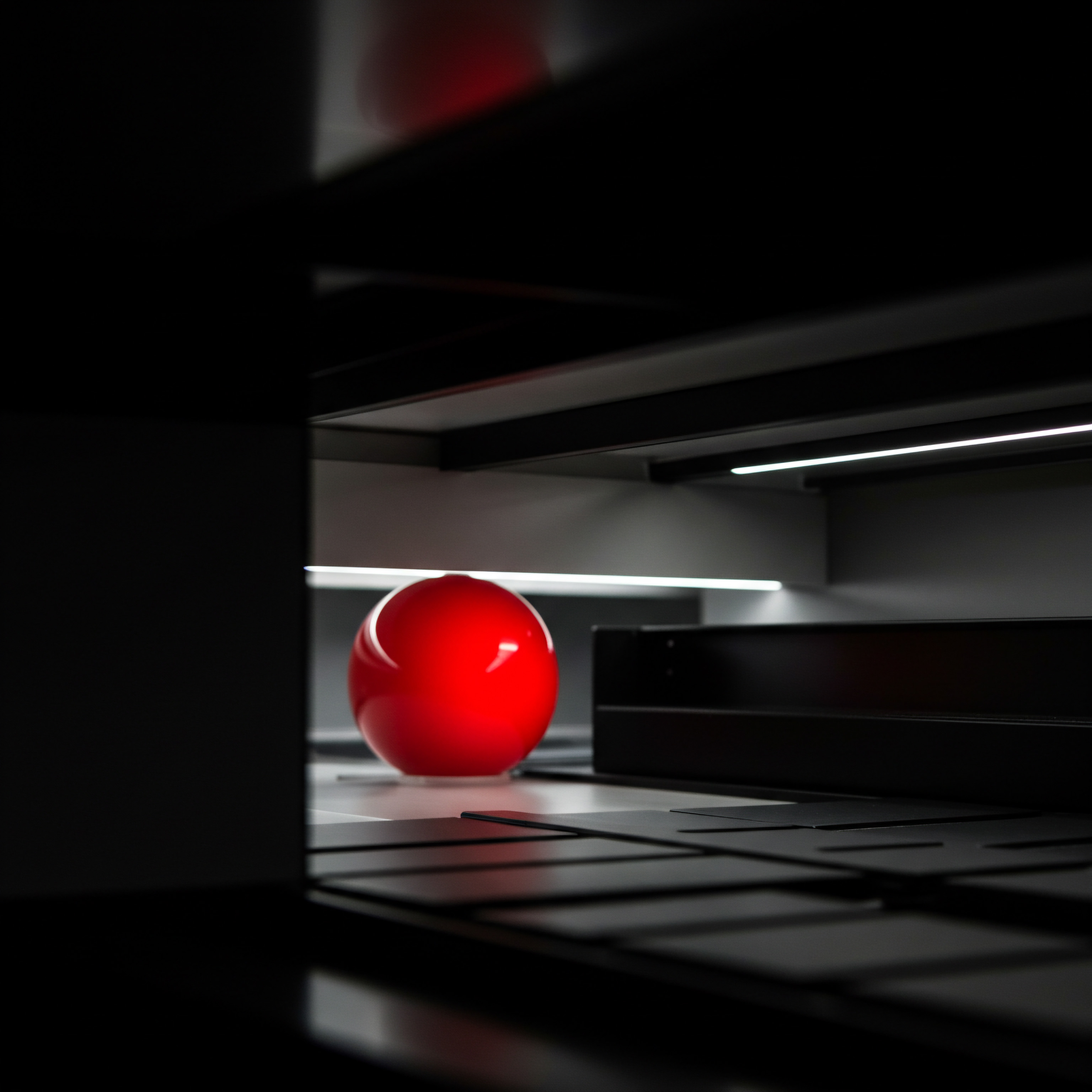 Bright Sphere in Dark Structure Depicts SMB Growth Automation and Implementation A compelling image focuses on a red sphere, placed artfully within a dark, structured setting reminiscent of a modern Workplace. This symbolizes the growth and expansion strategies crucial for any Small Business. Visualized are digital transformation elements highlighting the digital tools required for process automation that can improve Business development.