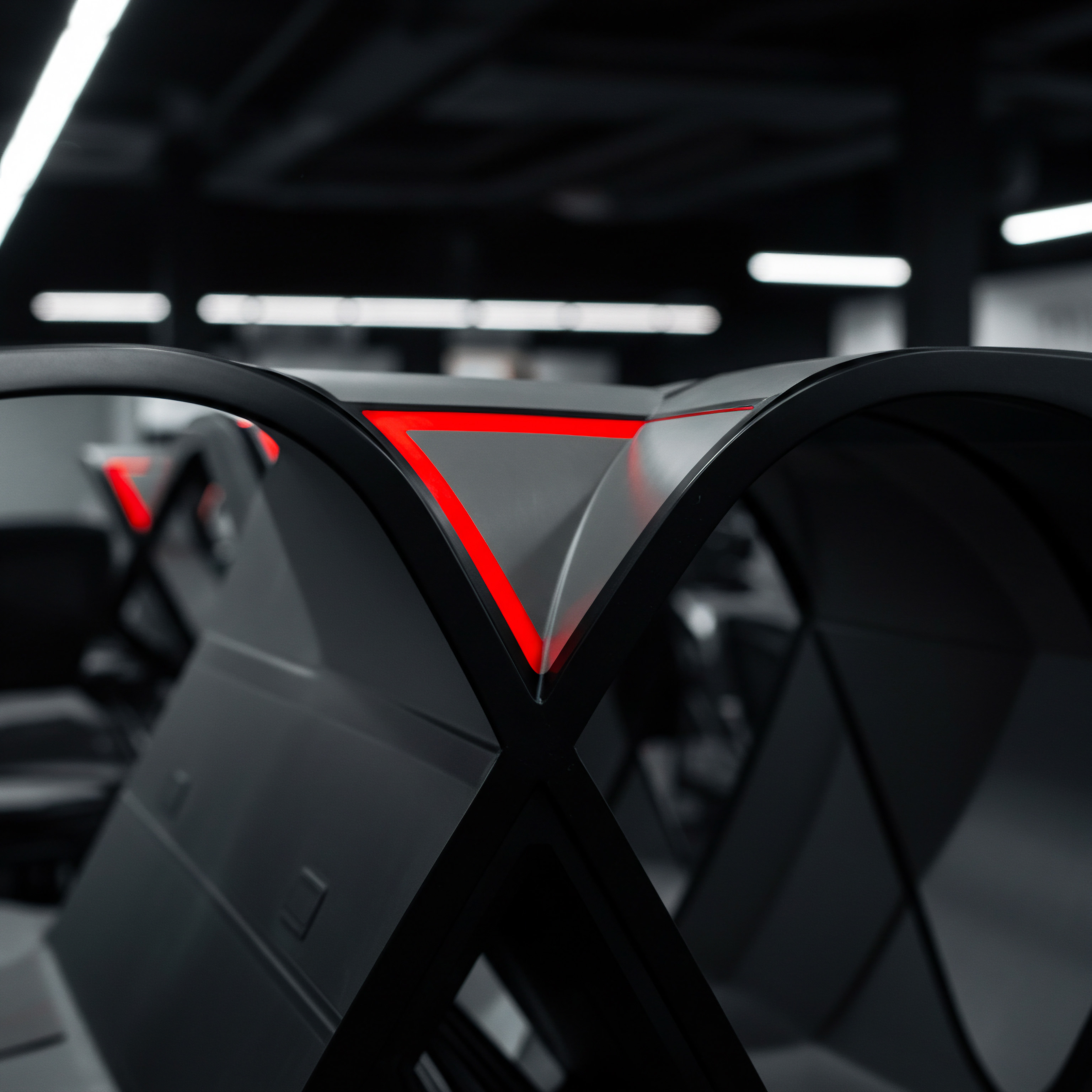 The photo shows modern office design for Small Business with emphasis on teamwork and collaboration, hinting at automation. Geometric elements form arches, highlighted by red light which symbolize efficient process automation and streamlines workflow optimization that will lead to increased scaling, efficiency, and productivity in the Startup. The composition encourages a modern, digital business outlook. The image suggests SaaS or other Digital Tools as integral for any scaling Strategy implemented. It emphasizes Optimization of current solutions for competitive advantage and success within their Market Share by way of improved technology. The setting and focus imply Professional Services related to Technology like Consulting with Agency to achieve Growth. The modern building's features may be used as Marketing Materials in Online Business models looking for innovation and positive opportunities with Future opportunities. The lighting represents new Ideas to achieve Business Goals.
