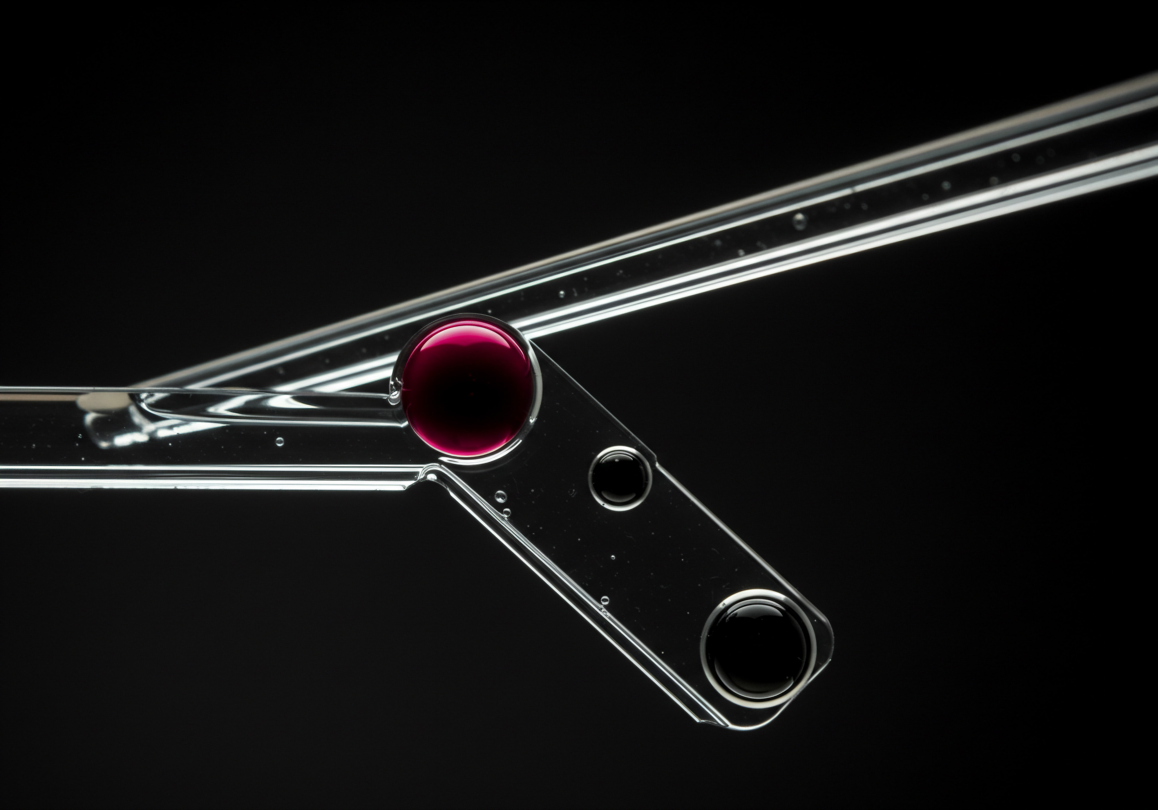 An eye-level studio shot displays interconnected clear glass tools, partly filled with red and black liquid, set against a deep black backdrop. The transparent instruments symbolize potential solutions and innovation within an abstract business context, appealing to Small Business Owners and Entrepreneurs looking to Scaling their ventures. This close-up is evocative of the careful Management of resources, Strategy formulation, and problem solving required in SMBs. The red and black fluids emphasize contrasting elements which suggests potential challenges and achievements on the Market, with Innovation in mind to provide SaaS services for improvement of their Workflow. Tools mirror digital Transformation via automation.