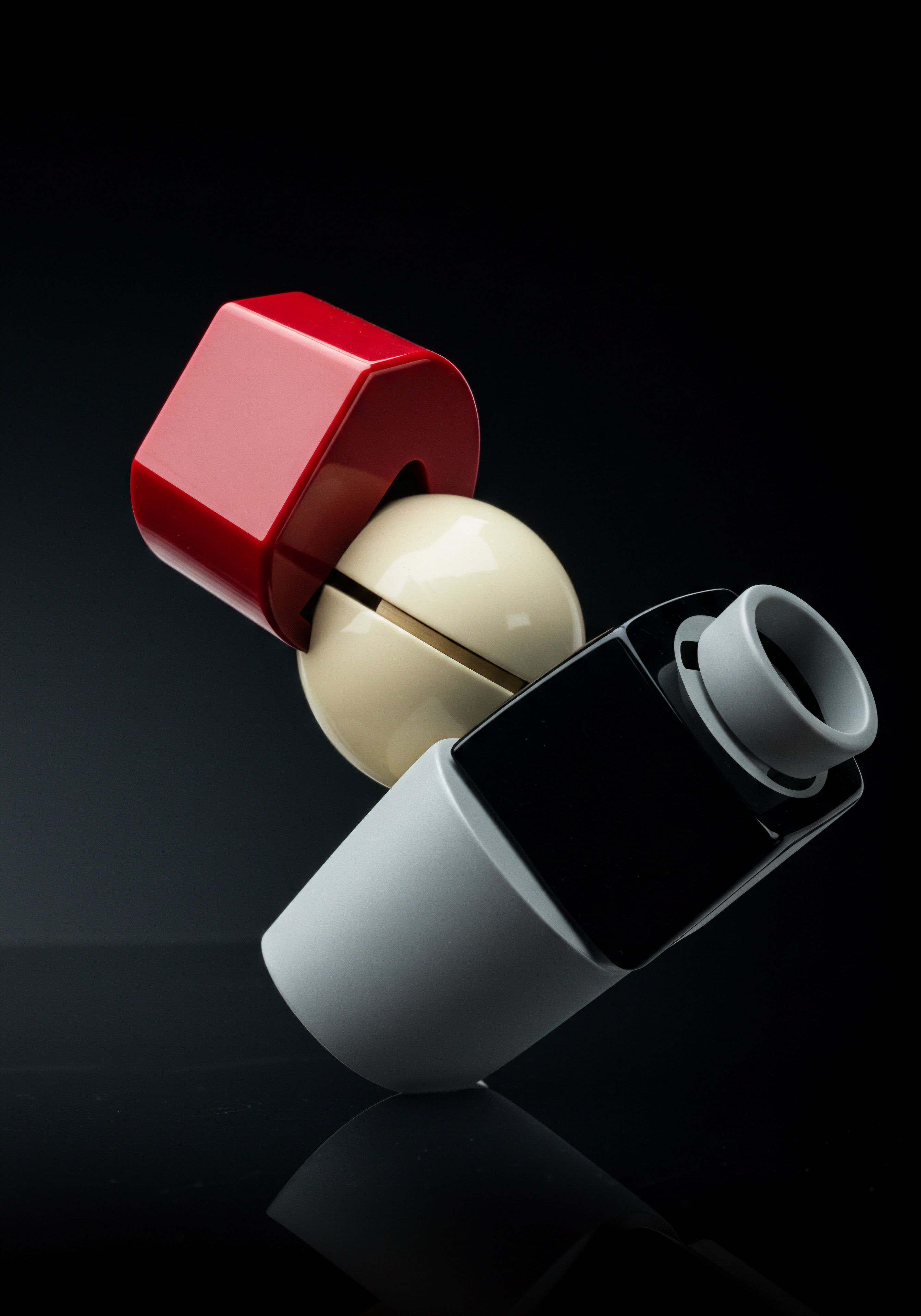 A conceptual composition showcasing the potential of innovation for small and medium business ventures. The setup presents a white sphere nestled between a minimalist red cube with a circular cutout and a sleek gray and black cylinder atop a mirrored surface against a stark black backdrop, symbolizing how a small business can magnify their reach. It could illustrate digital tools or software solutions for business automation. It suggests the importance of problem solving and finding tailored solutions using technology such as customer relationship management systems to help the business plan and the overall customer experience with the business. Such streamlining fosters expansion and efficient management.