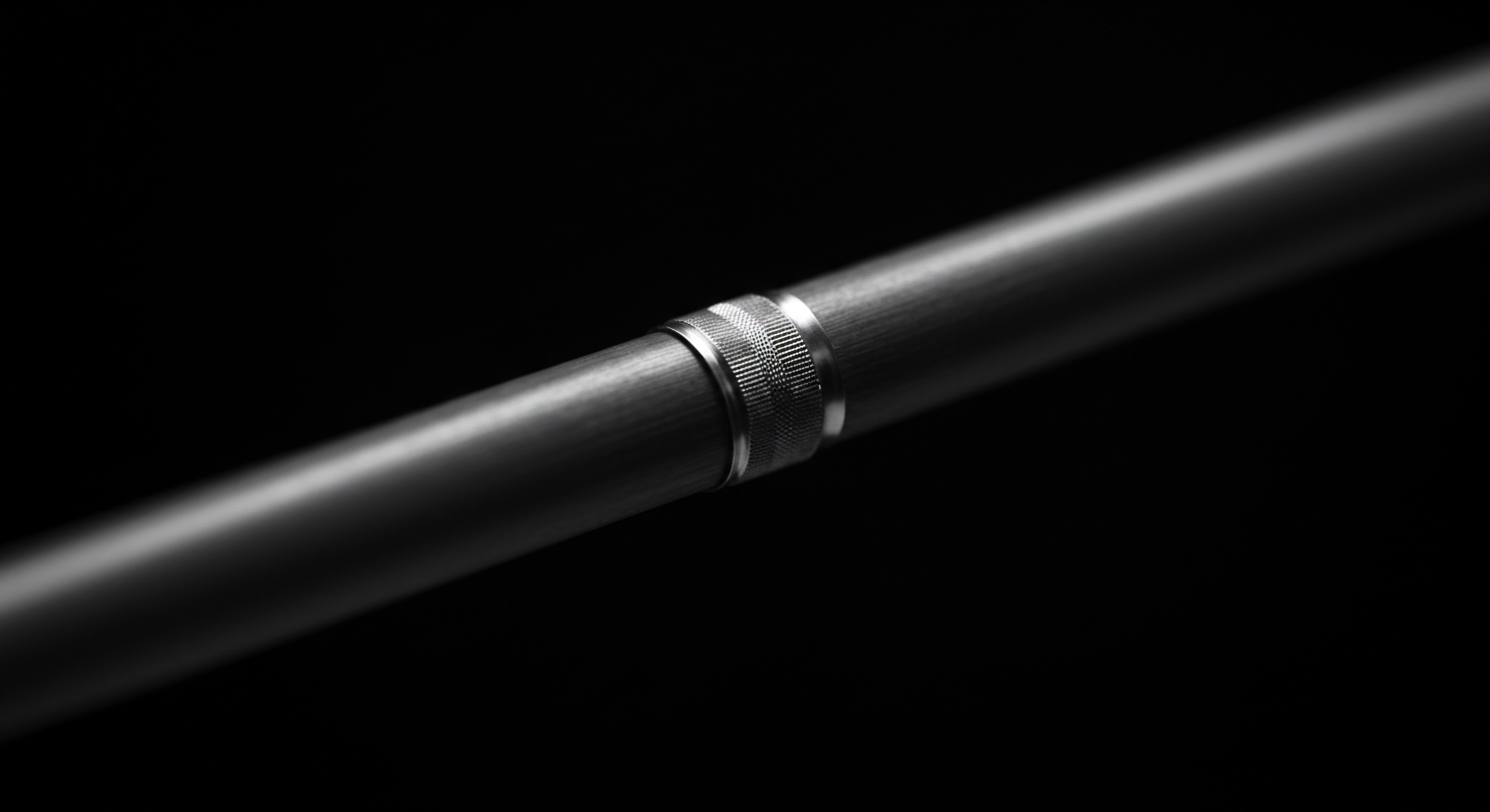 Metallic Pole Section Connecting Innovation with Support Structure in Modern Small Business A close-up showcases a gray pole segment featuring lengthwise grooves coupled with a knurled metallic band, which represents innovation through connectivity, suitable for illustrating streamlined business processes, from workflow automation to data integration. This object shows seamless system integration signifying process optimization and service solutions. The use of metallic component to the success of collaboration and operational efficiency, for small businesses and medium businesses, signifies project management, human resources, and improved customer service.