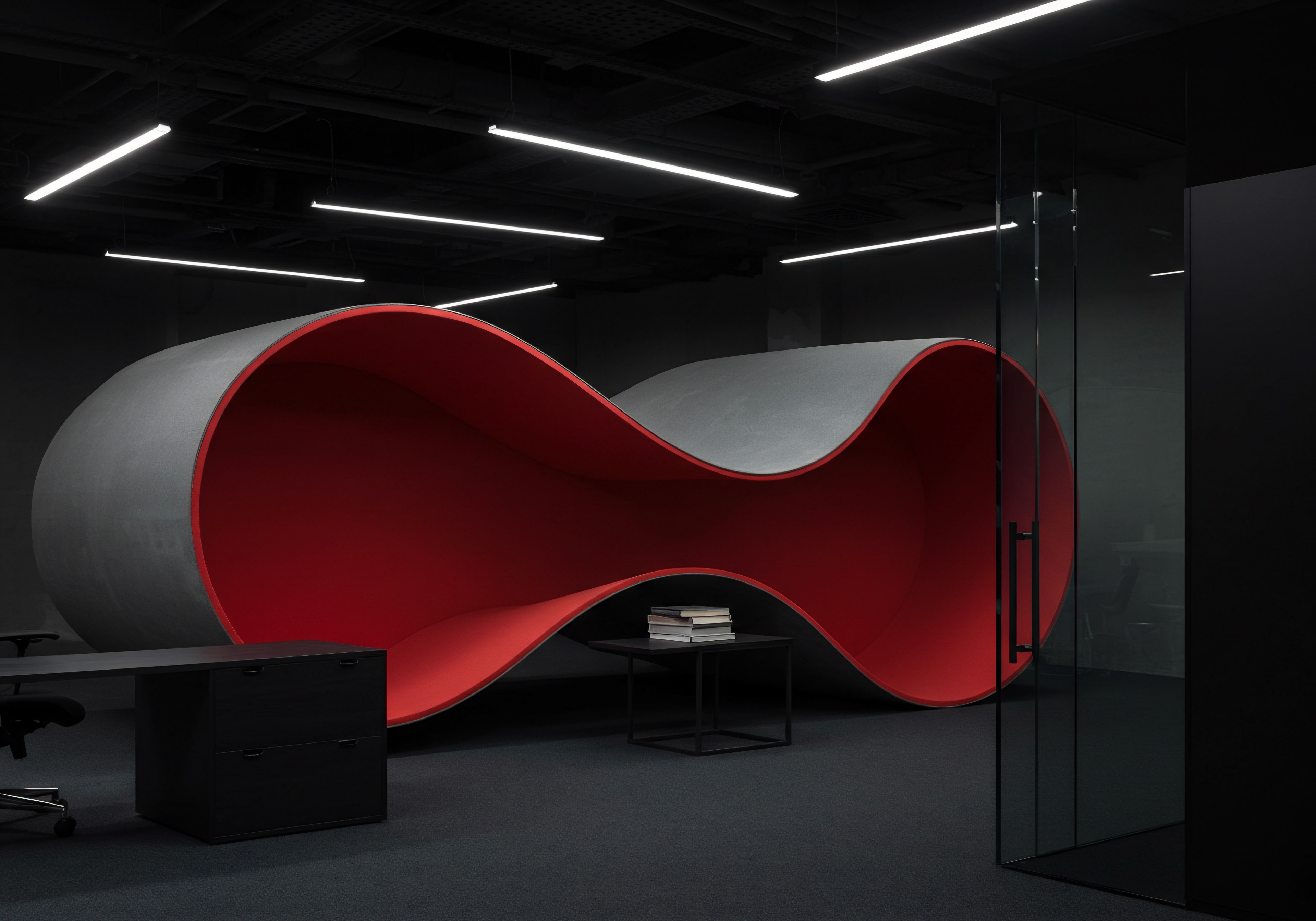 An open office is furnished for SMB expansion, offering space and collaborative opportunities. A large, grey organically rounded nook with bright red interior provides a focal point and meeting area. The black carpet adds to a neutral setting. Linear LED ceiling lights shine a glow on the area. A stack of books rests on a table next to the inviting niche, creating a sense of a curated workspace. This innovative design encourages brainstorming sessions. A desk and cabinet sit to the side for individual focus. This image highlights the modern approach small businesses and entrepreneurs take. The focus lies on future growth, digital transformation, and scaling efforts through process improvement and open business communication within the startup. It is a strategy to expand the small enterprise into something medium and larger.