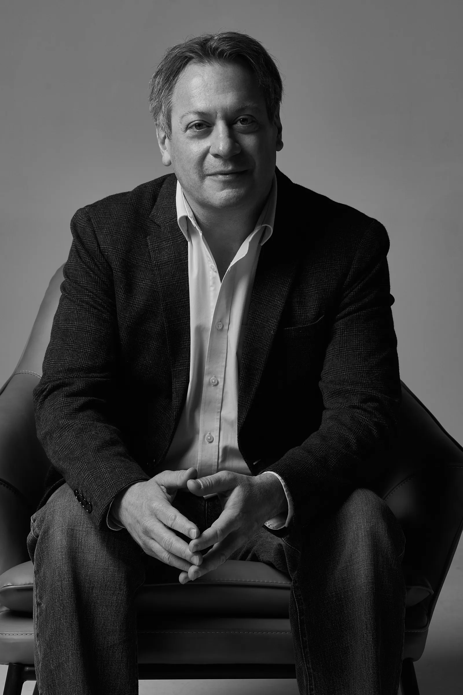 Lorne Michael Cousins, seated, in a studio portrait